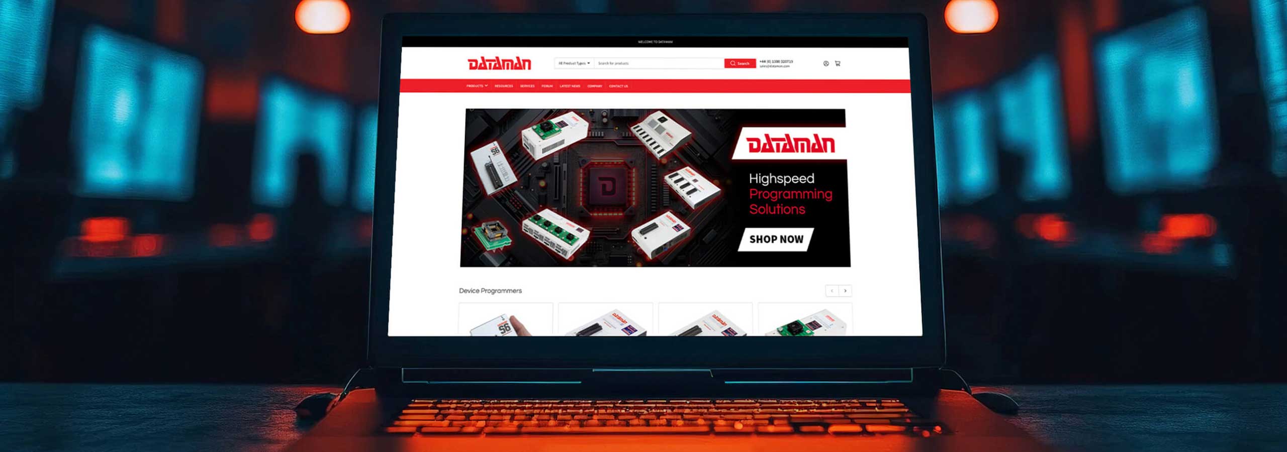 A laptop on a desk displaying a Shopify website design for Dataman