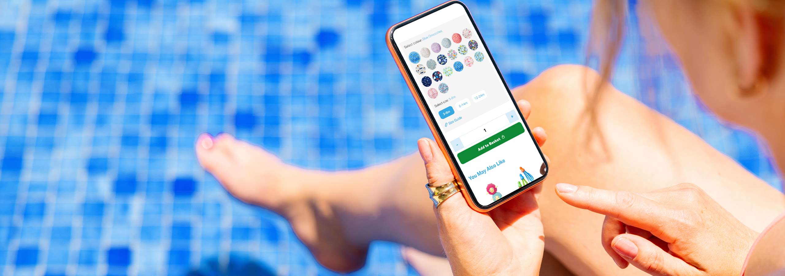 Holding a smartphone showing product page following Shopify A/B testing