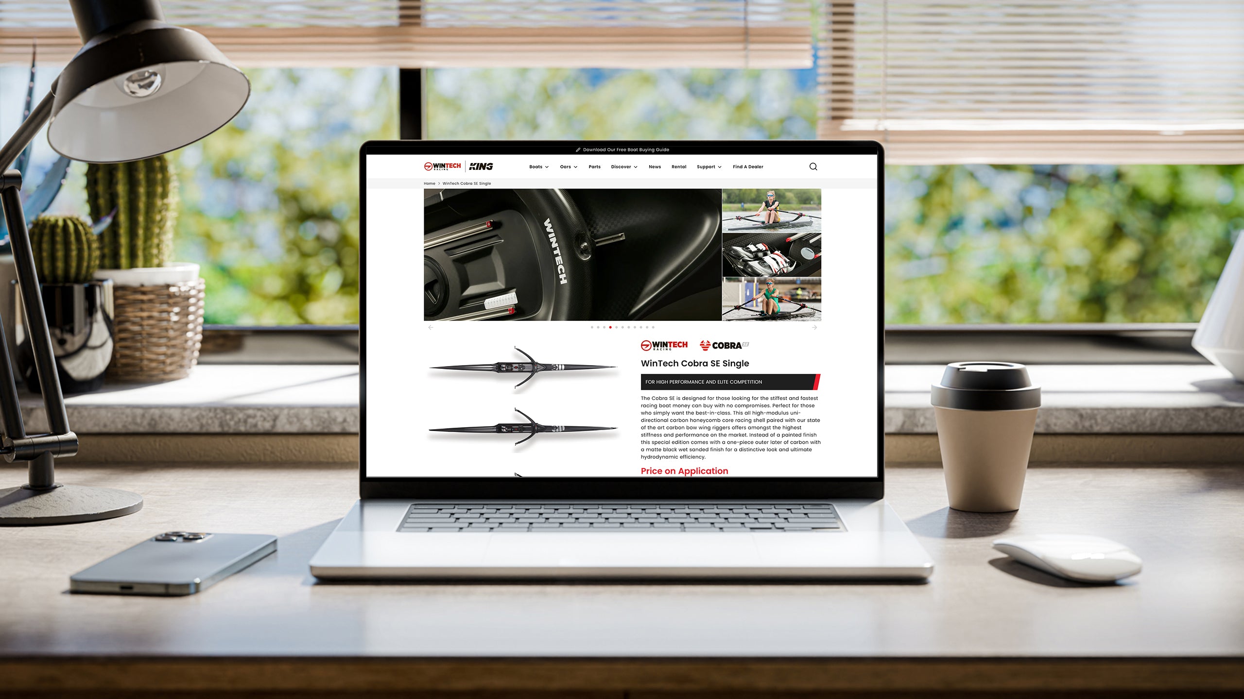 Laptop displaying the Wintech & King Shopify website design, showing the Cobra rowing boat product page.